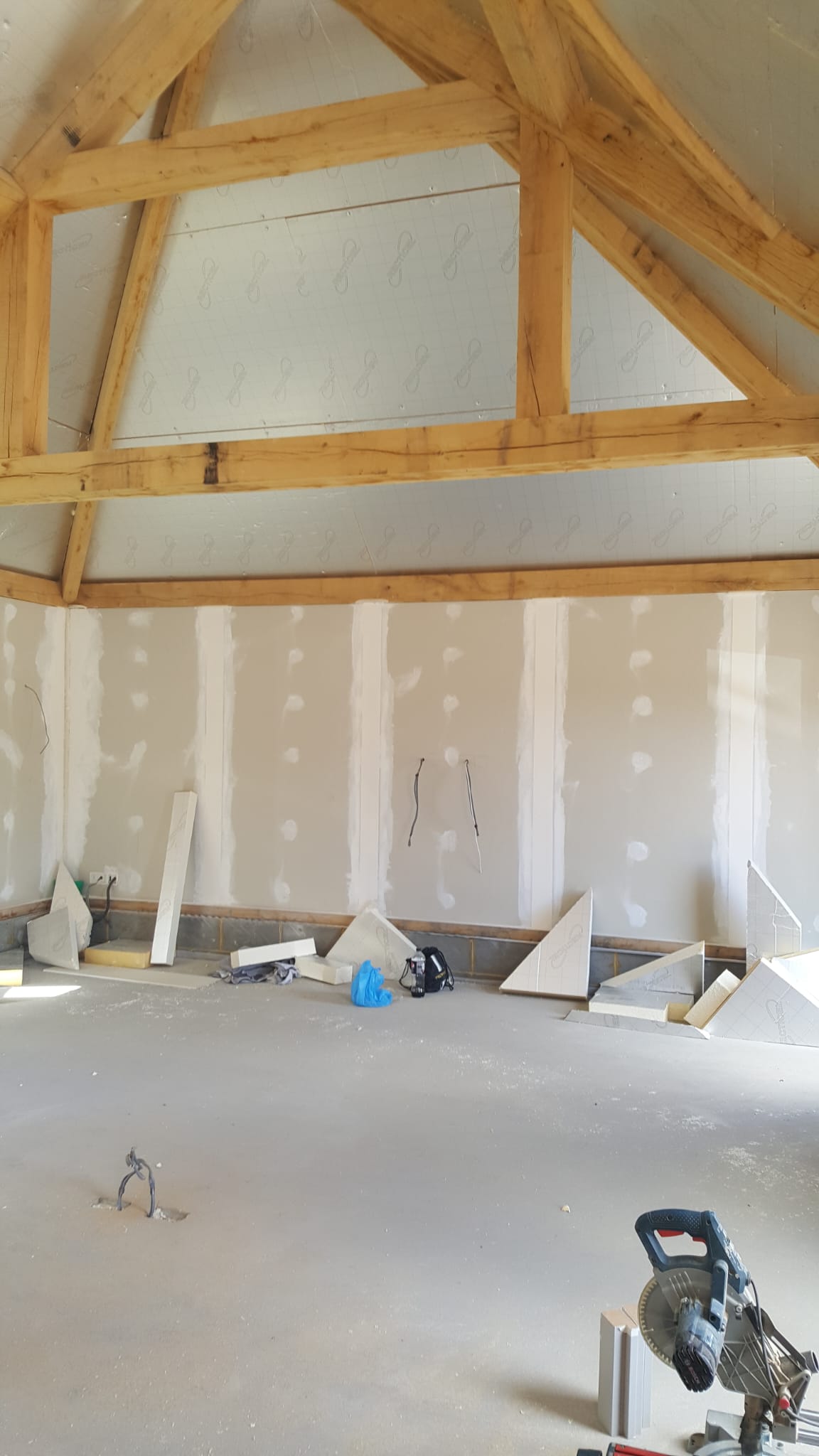 Decorator at work preparing a room for painting